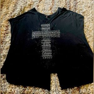 Black shirt with a gray cross in front and a split in the lower back.